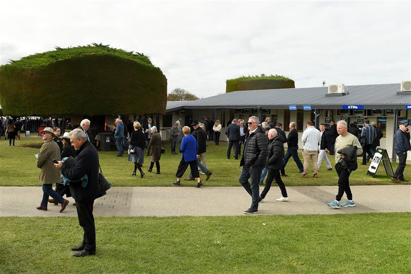 WARRNAMBOOL, AUSTRALIA - MAY 04: Spectators arrive ahead of Grand Annual Day at Warrnambool Racing Club on May 04, 2023 in Warrnambool, Australia. (Photo by Morgan Hancock/Getty Images)