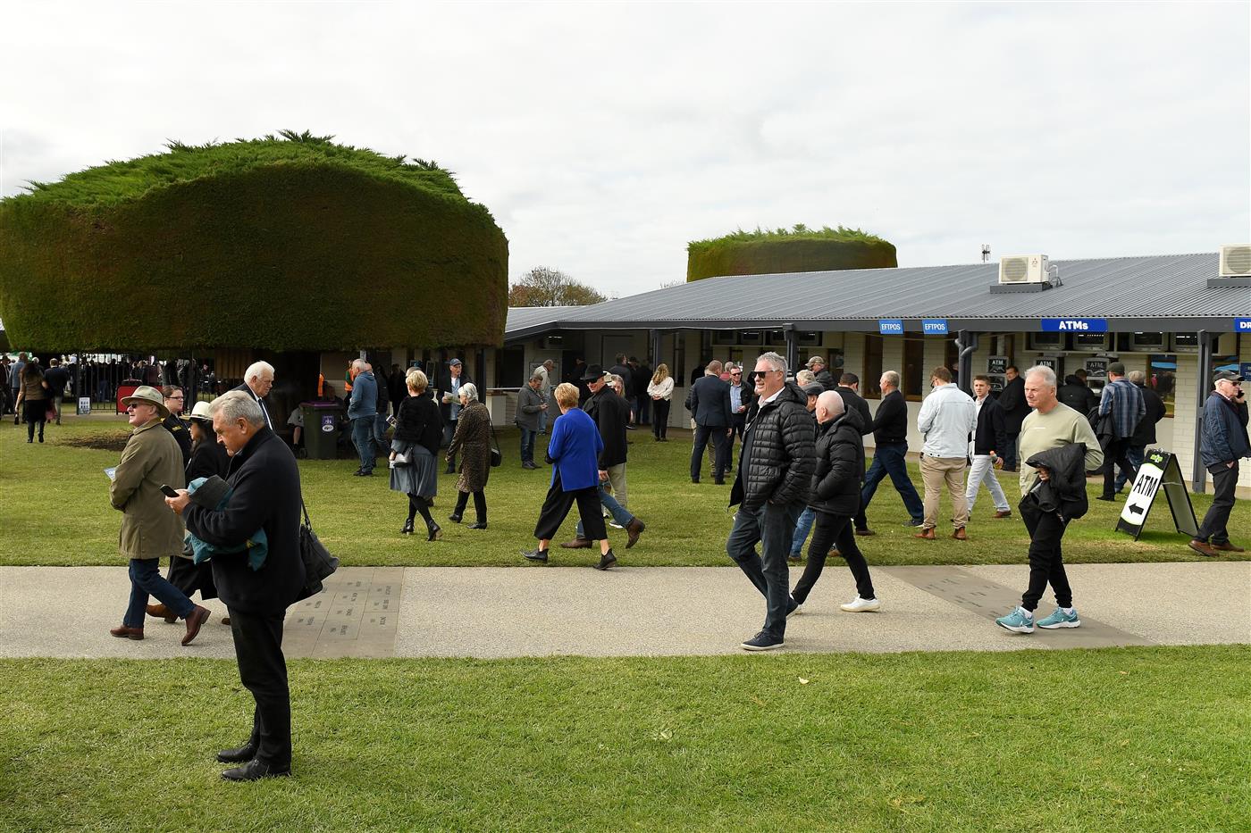 WARRNAMBOOL, AUSTRALIA - MAY 04: Spectators arrive ahead of Grand Annual Day at Warrnambool Racing Club on May 04, 2023 in Warrnambool, Australia. (Photo by Morgan Hancock/Getty Images)