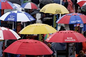 NEWMARKET, ENGLAND - MAY 06: Bookmakers umbrellas on a wet day at Newmarket Racecourse on May 06, 2023 in Newmarket, England. (Photo by Alan Crowhurst/Getty Images)