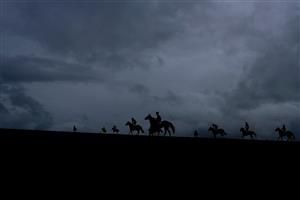 NEWMARKET, ENGLAND - MAY 06: A general view as runners ease down up the hill after finishing The Howden Handicap at Newmarket Racecourse on May 06, 2023 in Newmarket, England. (Photo by Alan Crowhurst/Getty Images)