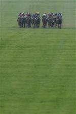 NEWMARKET, ENGLAND - MAY 06: A general view as runners make their way down the course during The Howden Suffolk Stakes at Newmarket Racecourse on May 06, 2023 in Newmarket, England. (Photo by Alan Crowhurst/Getty Images)