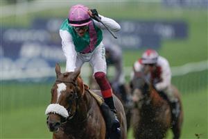 NEWMARKET, ENGLAND - MAY 06: Frankie Dettori riding Chaldean (pink cap) win The Qipco 2000 Guineas Stakes at Newmarket Racecourse on May 06, 2023 in Newmarket, England. (Photo by Alan Crowhurst/Getty Images)