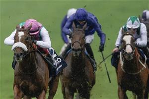NEWMARKET, ENGLAND - MAY 06: Frankie Dettori riding Chaldean (pink cap) win The Qipco 2000 Guineas Stakes at Newmarket Racecourse on May 06, 2023 in Newmarket, England. (Photo by Alan Crowhurst/Getty Images)