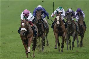 NEWMARKET, ENGLAND - MAY 06: Frankie Dettori riding Chaldean (pink cap) win The Qipco 2000 Guineas Stakes at Newmarket Racecourse on May 06, 2023 in Newmarket, England. (Photo by Alan Crowhurst/Getty Images)