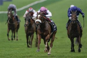 NEWMARKET, ENGLAND - MAY 06: Frankie Dettori riding Chaldean (pink cap) win The Qipco 2000 Guineas Stakes at Newmarket Racecourse on May 06, 2023 in Newmarket, England. (Photo by Alan Crowhurst/Getty Images)