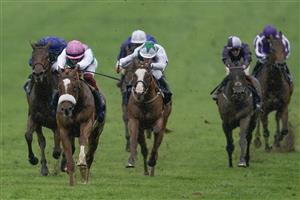 NEWMARKET, ENGLAND - MAY 06: Frankie Dettori riding Chaldean (pink cap) win The Qipco 2000 Guineas Stakes at Newmarket Racecourse on May 06, 2023 in Newmarket, England. (Photo by Alan Crowhurst/Getty Images)