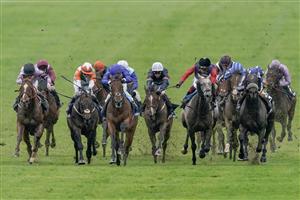 NEWMARKET, ENGLAND - MAY 06: William Buick riding King Of Conquest (all blue) win The Howden Suffolk Stakes at Newmarket Racecourse on May 06, 2023 in Newmarket, England. (Photo by Alan Crowhurst/Getty Images)