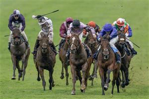 NEWMARKET, ENGLAND - MAY 06: William Buick riding King Of Conquest (all blue) win The Howden Suffolk Stakes at Newmarket Racecourse on May 06, 2023 in Newmarket, England. (Photo by Alan Crowhurst/Getty Images)