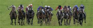 NEWMARKET, ENGLAND - MAY 06: William Buick riding King Of Conquest (all blue) win The Howden Suffolk Stakes at Newmarket Racecourse on May 06, 2023 in Newmarket, England. (Photo by Alan Crowhurst/Getty Images)
