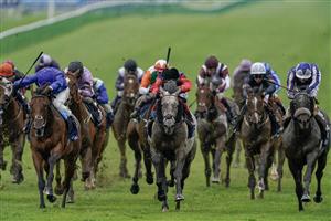 NEWMARKET, ENGLAND - MAY 06: William Buick riding King Of Conquest (all blue) win The Howden Suffolk Stakes at Newmarket Racecourse on May 06, 2023 in Newmarket, England. (Photo by Alan Crowhurst/Getty Images)