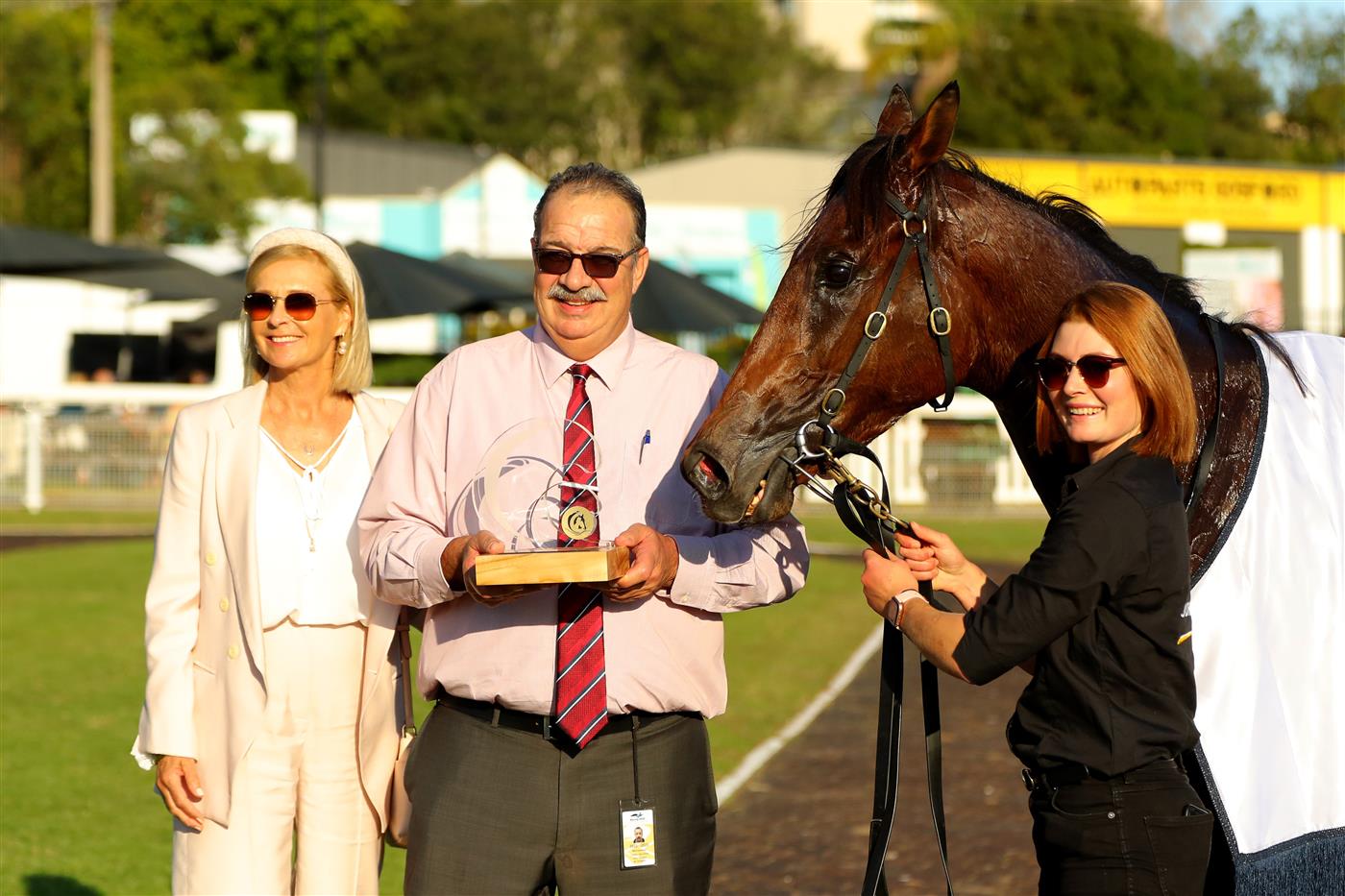 GOSFORD, AUSTRALIA - MAY 06: Trainer John Sargent (c) poses with a trophy after winning Race 8 The Coast with Kerrin McEvoy riding Palmetto during "Gosford Gold Cup" - Sydney Racing at Gosford Racecourse on May 06, 2023 in Gosford, Australia. (Photo by Jeremy Ng/Getty Images)