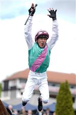 CHESTER, ENGLAND - MAY 10: Frankie Dettori leaps from his mount after riding Arrest to win The Boodles Chester Vase Stakes at Chester Racecourse on May 10, 2023 in Chester, England. (Photo by Alan Crowhurst/Getty Images)