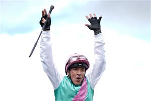 CHESTER, ENGLAND - MAY 10: Frankie Dettori leaps from his mount after riding Arrest to win The Boodles Chester Vase Stakes at Chester Racecourse on May 10, 2023 in Chester, England. (Photo by Alan Crowhurst/Getty Images)