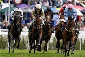 CHESTER, ENGLAND - MAY 10: Ryan Moore riding Savethelastdance (C, dark blue) on their way to easily win The Weatherbys Digital Solutions Cheshire Oaks at Chester Racecourse on May 10, 2023 in Chester, England. (Photo by Alan Crowhurst/Getty Images)