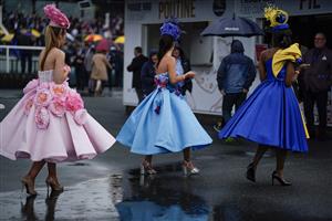 CHESTER, ENGLAND - MAY 10: Fashion in the rain at Chester Racecourse on May 10, 2023 in Chester, England. (Photo by Alan Crowhurst/Getty Images)