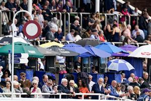 CHESTER, ENGLAND - MAY 11: Racegoers and bookmakers at Chester Racecourse on May 11, 2023 in Chester, England. (Photo by Alan Crowhurst/Getty Images)