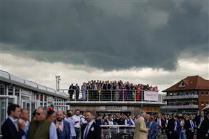 CHESTER, ENGLAND - MAY 11: Racegoers watch from their vantage point at Chester Racecourse on May 11, 2023 in Chester, England. (Photo by Alan Crowhurst/Getty Images)