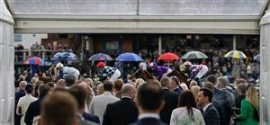 CHESTER, ENGLAND - MAY 11: Racegoers look on as runners pass at Chester Racecourse on May 11, 2023 in Chester, England. (Photo by Alan Crowhurst/Getty Images)