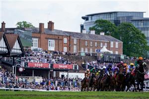 CHESTER, ENGLAND - MAY 12: Saffie Osborne riding Metier (L, orange) on their way to winning The tote Chester Cup at Chester Racecourse on May 12, 2023 in Chester, England. (Photo by Alan Crowhurst/Getty Images)
