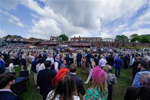 CHESTER, ENGLAND - MAY 12: A general view as racegoers watch The Precision Facades Handicap as they pass at Chester Racecourse on May 12, 2023 in Chester, England. (Photo by Alan Crowhurst/Getty Images)