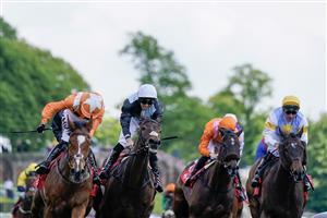 CHESTER, ENGLAND - MAY 12: Saffie Osborne riding Metier (L, orange) win The tote Chester Cup at Chester Racecourse on May 12, 2023 in Chester, England. (Photo by Alan Crowhurst/Getty Images)