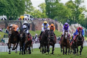CHESTER, ENGLAND - MAY 12: Saffie Osborne riding Metier (L, orange) win The tote Chester Cup at Chester Racecourse on May 12, 2023 in Chester, England. (Photo by Alan Crowhurst/Getty Images)