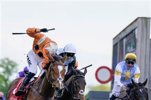 CHESTER, ENGLAND - MAY 12: Saffie Osborne riding Metier (L, orange) win The tote Chester Cup at Chester Racecourse on May 12, 2023 in Chester, England. (Photo by Alan Crowhurst/Getty Images)