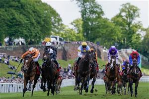 CHESTER, ENGLAND - MAY 12: Saffie Osborne riding Metier (L, orange) win The tote Chester Cup at Chester Racecourse on May 12, 2023 in Chester, England. (Photo by Alan Crowhurst/Getty Images)