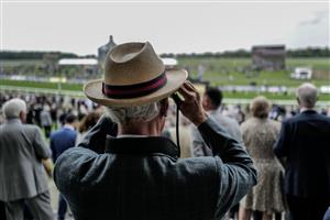 YORK, ENGLAND - MAY 18: A racegoer watches the action at York Racecourse on May 18, 2023 in York, England. (Photo by Alan Crowhurst/Getty Images)