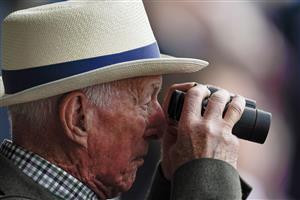 YORK, ENGLAND - MAY 18: Racegoer with binoculars at York Racecourse on May 18, 2023 in York, England. (Photo by Alan Crowhurst/Getty Images)