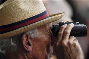 YORK, ENGLAND - MAY 18: Watching the action through binoculars at York Racecourse on May 18, 2023 in York, England. (Photo by Alan Crowhurst/Getty Images)