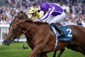 NEWBURY, ENGLAND - MAY 20: Ryan Moore riding Bertinelli (purple) win The BetVictor London Gold Cup Heritage Handicap at Newbury Racecourse on May 20, 2023 in Newbury, England. (Photo by Alan Crowhurst/Getty Images)