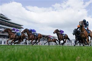 NEWBURY, ENGLAND - MAY 20: Ryan Moore riding Bertinelli (L, purple) win The BetVictor London Gold Cup Heritage Handicap at Newbury Racecourse on May 20, 2023 in Newbury, England. (Photo by Alan Crowhurst/Getty Images)