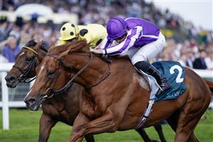 NEWBURY, ENGLAND - MAY 20: Ryan Moore riding Bertinelli (purple) win The BetVictor London Gold Cup Heritage Handicap at Newbury Racecourse on May 20, 2023 in Newbury, England. (Photo by Alan Crowhurst/Getty Images)