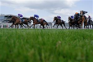 NEWBURY, ENGLAND - MAY 20: Ryan Moore riding Bertinelli (L, purple) win The BetVictor London Gold Cup Heritage Handicap at Newbury Racecourse on May 20, 2023 in Newbury, England. (Photo by Alan Crowhurst/Getty Images)