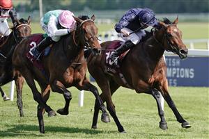 NEWBURY, ENGLAND - MAY 20: Ryan Moore riding Warm Heart (R) win The Haras De Bouquetot Fillies' Trial Stakes at Newbury Racecourse on May 20, 2023 in Newbury, England. (Photo by Alan Crowhurst/Getty Images)