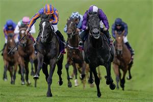 EPSOM, ENGLAND - JUNE 03: Ryan Moore riding Auguste Rodin (blue/orange) win The Betfred Derby from Rossa Ryan and King Of Steel (purple) on Derby Day at Epsom Racecourse on June 03, 2023 in Epsom, England. (Photo by Alan Crowhurst/Getty Images)