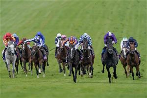 EPSOM, ENGLAND - JUNE 03: Ryan Moore riding Auguste Rodin (blue/orange) win The Betfred Derby from Rossa Ryan and King Of Steel (purple) on Derby Day at Epsom Racecourse on June 03, 2023 in Epsom, England. (Photo by Alan Crowhurst/Getty Images)