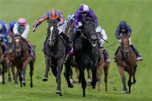 EPSOM, ENGLAND - JUNE 03: Ryan Moore riding Auguste Rodin (blue/orange) win The Betfred Derby from Rossa Ryan and King Of Steel (purple) on Derby Day at Epsom Racecourse on June 03, 2023 in Epsom, England. (Photo by Alan Crowhurst/Getty Images)