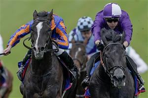 EPSOM, ENGLAND - JUNE 03: Ryan Moore riding Auguste Rodin (blue/orange) win The Betfred Derby from Kevin Stott and King Of Steel (purple) on Derby Day at Epsom Racecourse on June 03, 2023 in Epsom, England. (Photo by Alan Crowhurst/Getty Images)