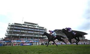 EPSOM, ENGLAND - JUNE 03: Auguste Rodin ridden by Ryan Moore (orange and blue silks) wins The Betfred Derby during Derby Day at Epsom Downs Racecourse on June 03, 2023 in Epsom, England. (Photo by Warren Little/Getty Images)