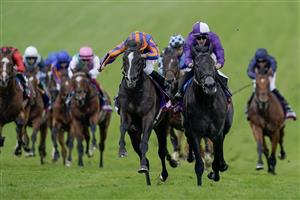 EPSOM, ENGLAND - JUNE 03: Ryan Moore riding Auguste Rodin (blue/orange) win The Betfred Derby from Rossa Ryan and King Of Steel (purple) on Derby Day at Epsom Racecourse on June 03, 2023 in Epsom, England. (Photo by Alan Crowhurst/Getty Images)