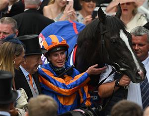 TOPSHOT - Jockey Ryan Moore in the winner's enclosure with Auguste Rodin after winning the Derby on the second day of the Epsom Derby Festival horse racing event in Surrey, southern England on June 3, 2023. (Photo by Ben Stansall / AFP) (Photo by BEN STANSALL/AFP via Getty Images)
