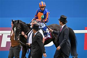 Jockey Ryan Moore is interviewed as he returns to the winner's enclosure on Auguste Rodin after winning the Derby on the second day of the Epsom Derby Festival horse racing event in Surrey, southern England on June 3, 2023. (Photo by Ben Stansall / AFP) (Photo by BEN STANSALL/AFP via Getty Images)