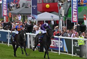 Jockey Ryan Moore riding Auguste Rodin (L) beats jockey Kevin Stott on King Of Steel (R) in the Derby on the second day of the Epsom Derby Festival horse racing event in Surrey, southern England on June 3, 2023. (Photo by Ben Stansall / AFP) (Photo by BEN STANSALL/AFP via Getty Images)