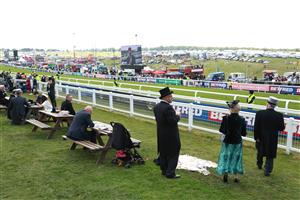 EPSOM, ENGLAND - JUNE 03: Race goers are pictured during Derby Day at Epsom Downs Racecourse on June 03, 2023 in Epsom, England. (Photo by Warren Little/Getty Images)