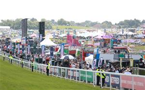 EPSOM, ENGLAND - JUNE 03: Race goers are pictured during Derby Day at Epsom Downs Racecourse on June 03, 2023 in Epsom, England. (Photo by Warren Little/Getty Images)