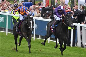 Jockey Ryan Moore riding Auguste Rodin (L) beats jockey Kevin Stott on King Of Steel (R) in the Derby on the second day of the Epsom Derby Festival horse racing event in Surrey, southern England on June 3, 2023. (Photo by Ben Stansall / AFP) (Photo by BEN STANSALL/AFP via Getty Images)