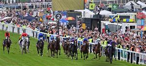 The field enter the final furlongs in the Derby on the second day of the Epsom Derby Festival horse racing event in Surrey, southern England on June 3, 2023. (Photo by Ben Stansall / AFP) (Photo by BEN STANSALL/AFP via Getty Images)
