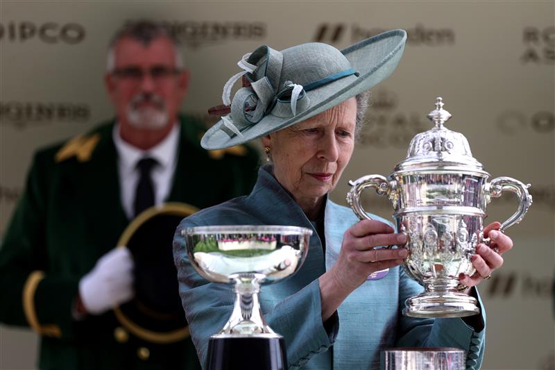 ASCOT, ENGLAND - JUNE 20: Anne, Princess Royal lifts the winners trophy for the St James's Palace Stakes Royal Ascot 2023 at Ascot Racecourse on June 20, 2023 in Ascot, England. (Photo by Alex Pantling/Getty Images)